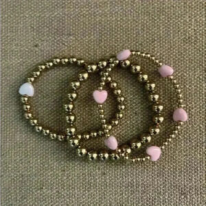 Set of 3 beaded bracelets gold white pink